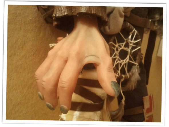 Close up of the hand details of the goblin doll.
