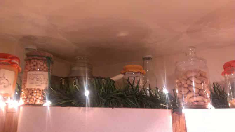 Fairy lights and Christmas garlands sat atop kitchen cupboards.