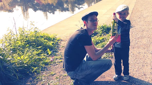 Lucien and I holding the bottle just before throwing it in the river Medway.