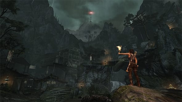 Lara Croft from the Tomb Raider game, exploring a cavern with a torch in her hand.