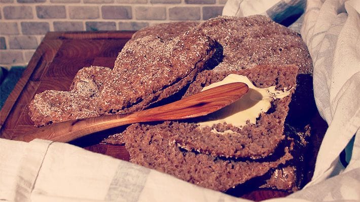 Vaasan Ruispalat dark rye bread with a generous dollop of butter on it