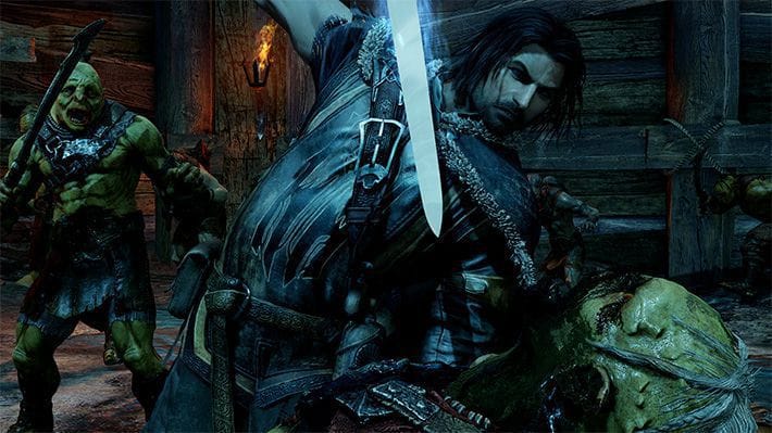 Talion in the middle of slashing an Orcs head off