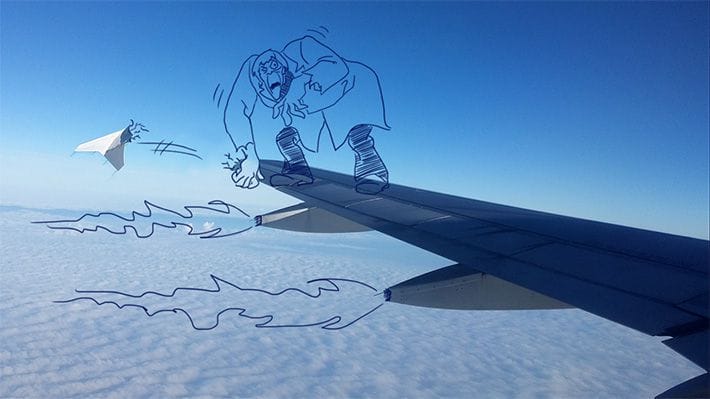 Photo of an airplane wing with humours Scooby Doo-inspired illustrations on top