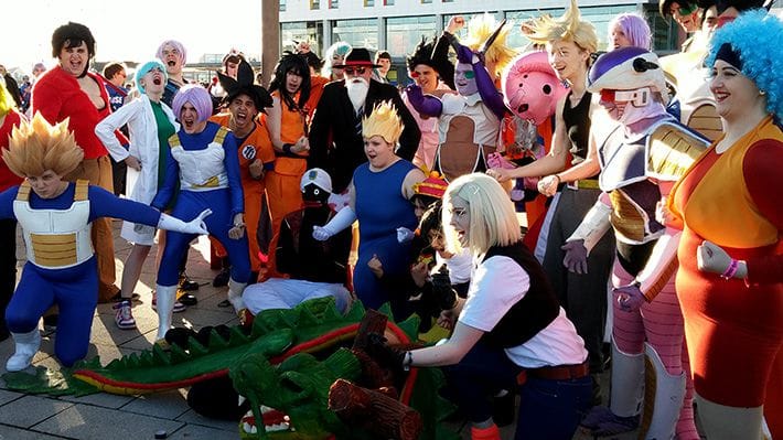 Large gang of cosplayers dressed as characters from the Dragon Ball series.