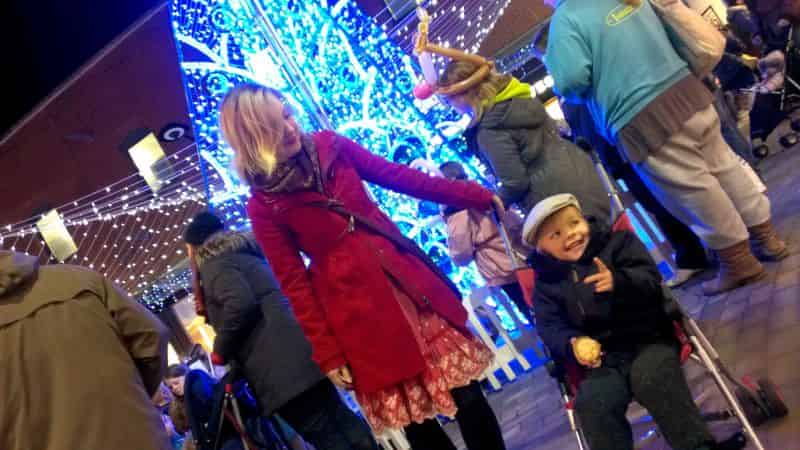 Lucien and Rebecka at the Maidstone Christmas Lights events, Lucien holding two fingers up for no reason.