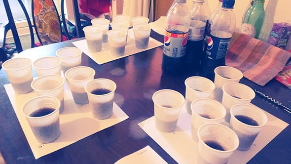 Three sets of seven cups with all the different beverages, ready for testing.