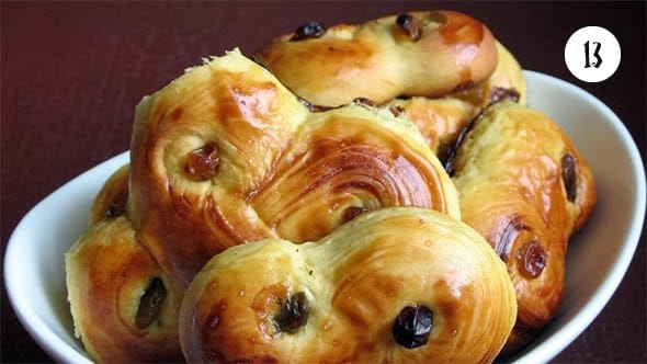 Golden saffron buns in a bowl.