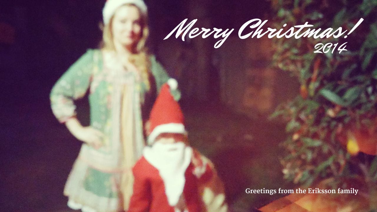 Lucien dressed as Santa and Rebecka dressed as a helpful elf.