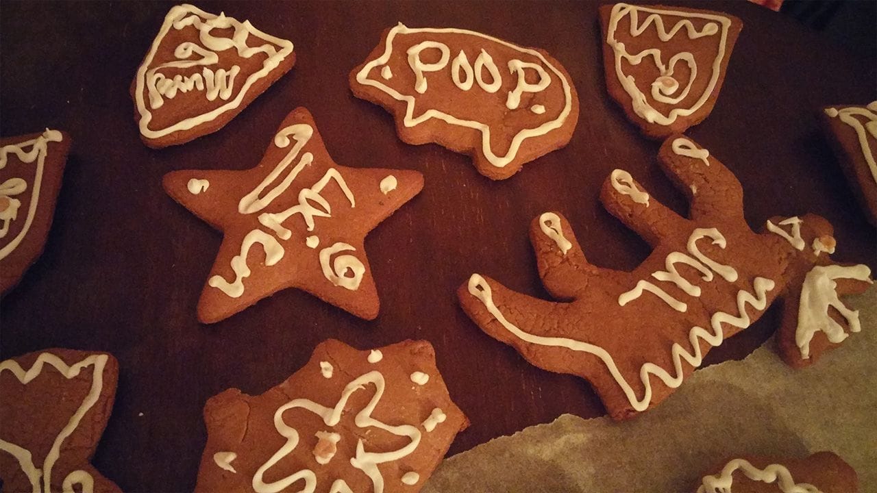 Gingerbread cookies with writing on them.