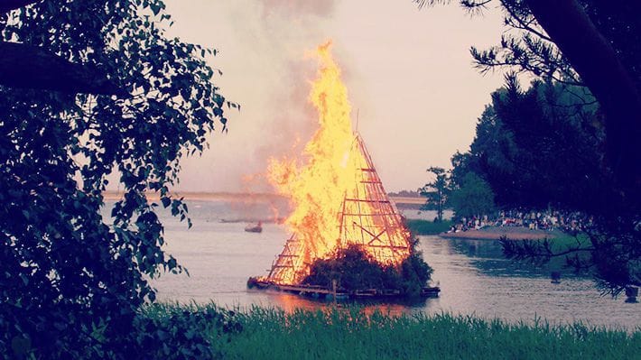 A giant float of burning wood