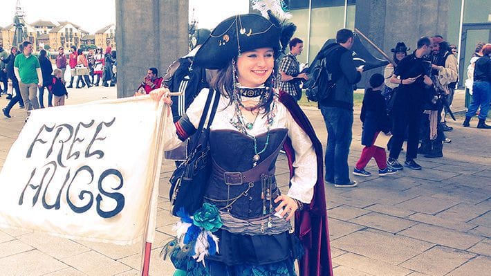 Woman pirate cosplayer giving out FREE HUGS