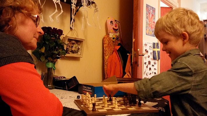 Lucien and his grandmother playing chess.