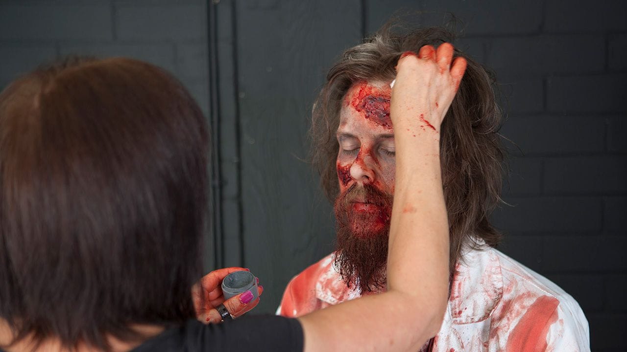 Kate continuing on transforming Carlos into a zombie.
