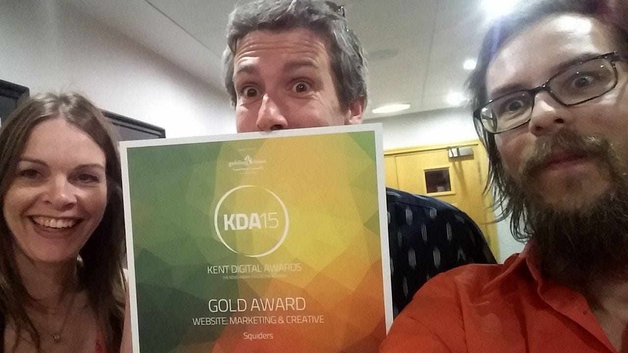 The Squiders team holding the Gold award for Creative and Market at the Kent Digital Awards.