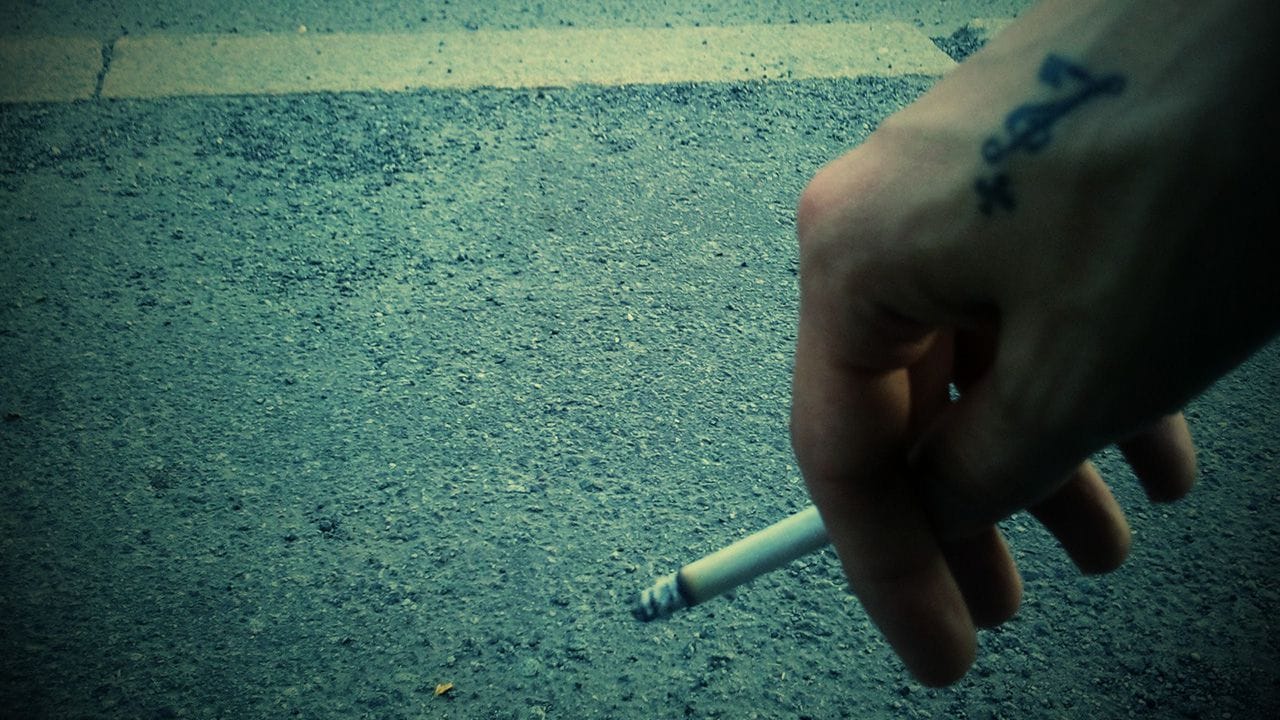 Me holding a cigarette four years ago.