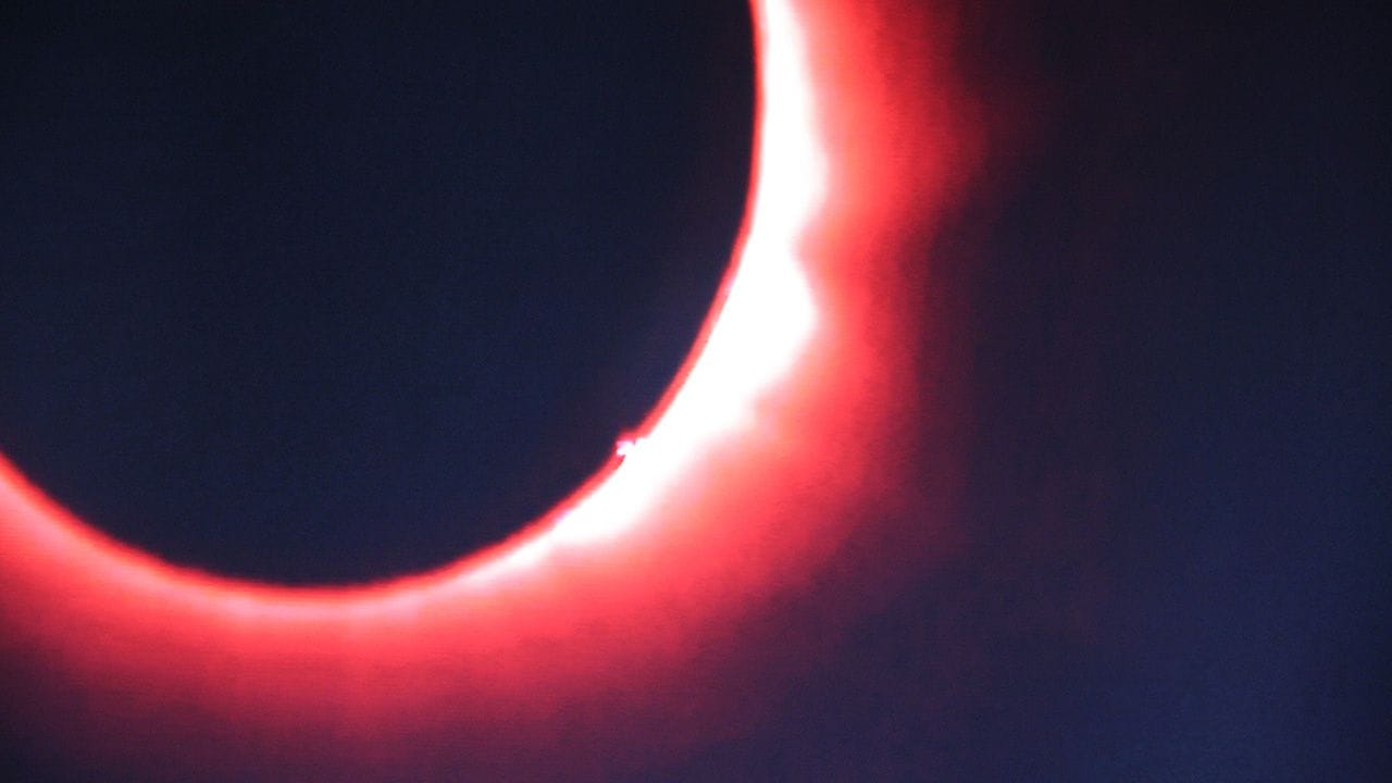 The Solar Eclipse of 2015, a beatutiful red-tinted shot 