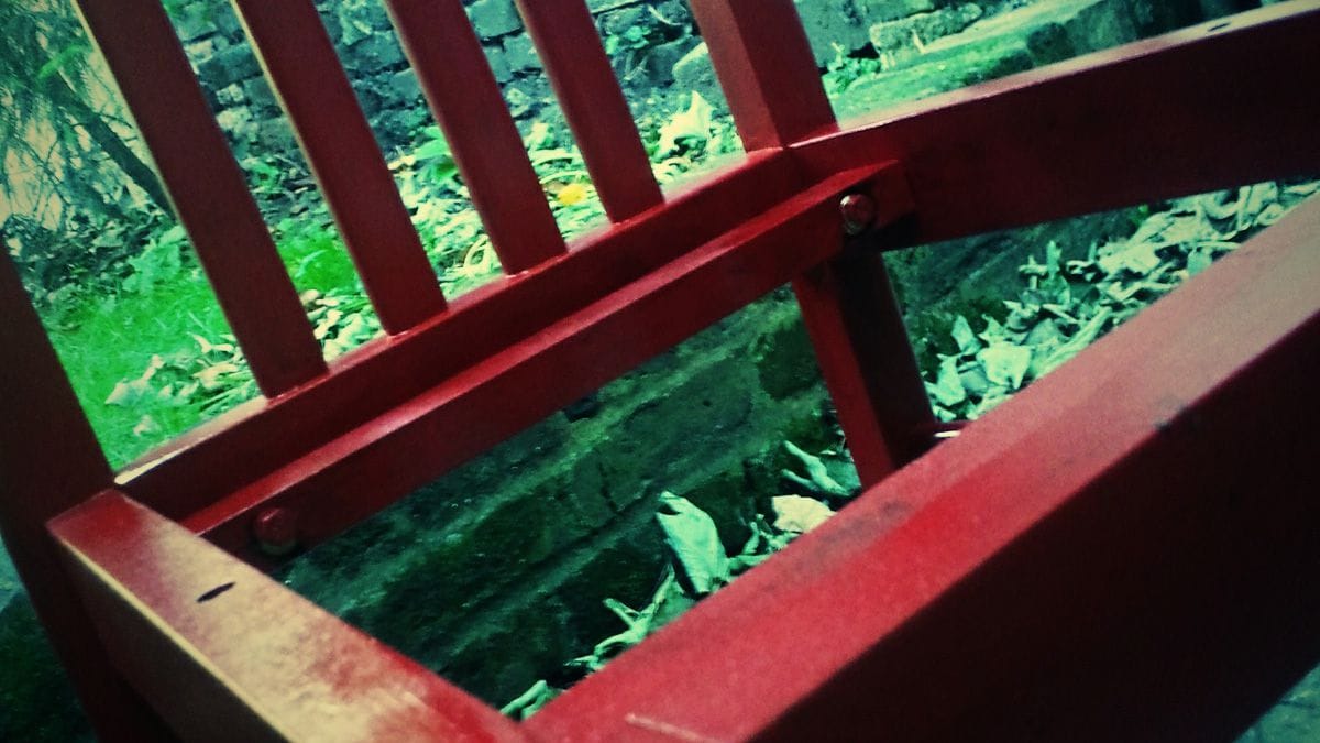 Close up of a chair being painted.