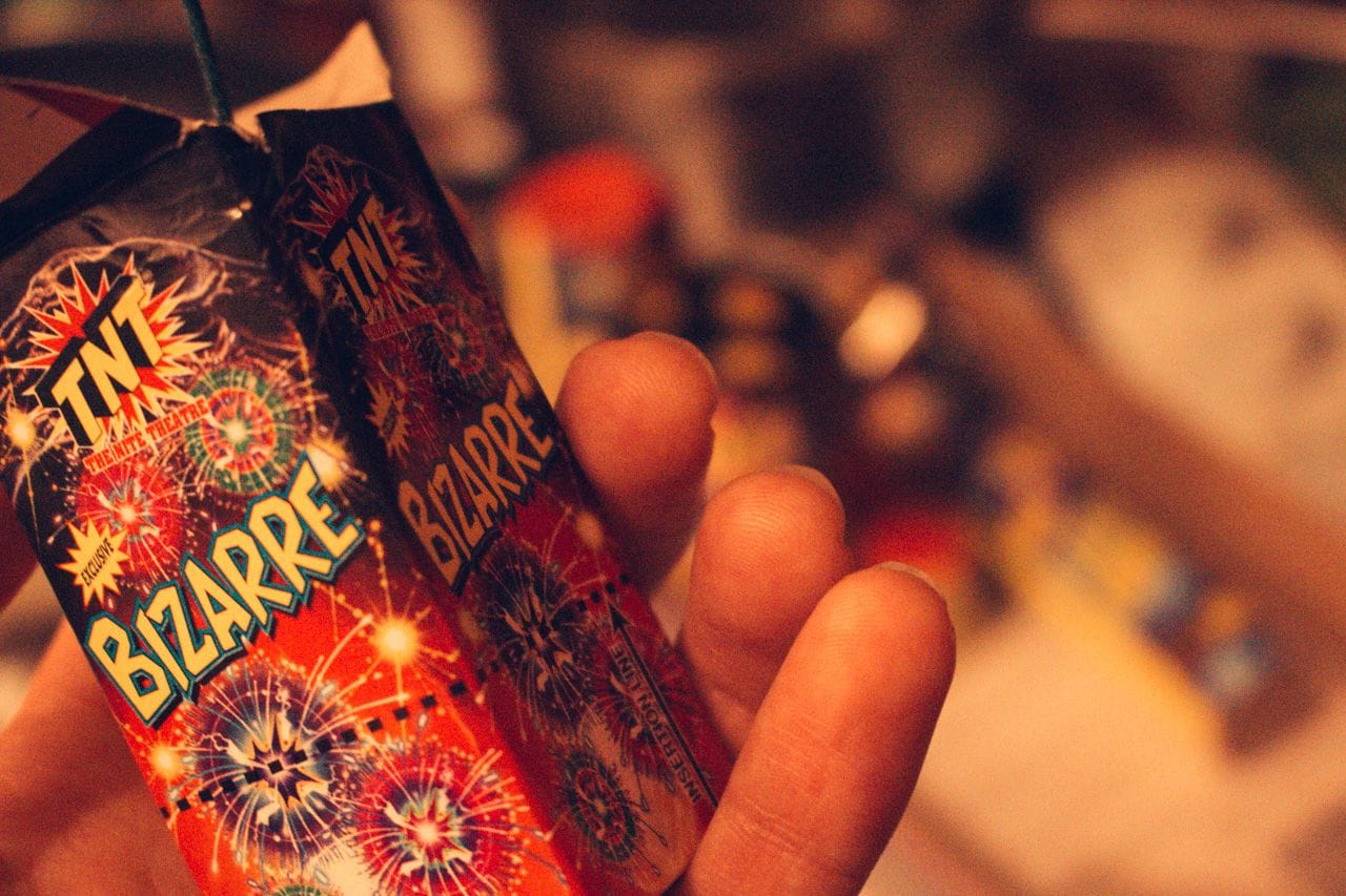 A hand holding a fireworks called Bizarre.