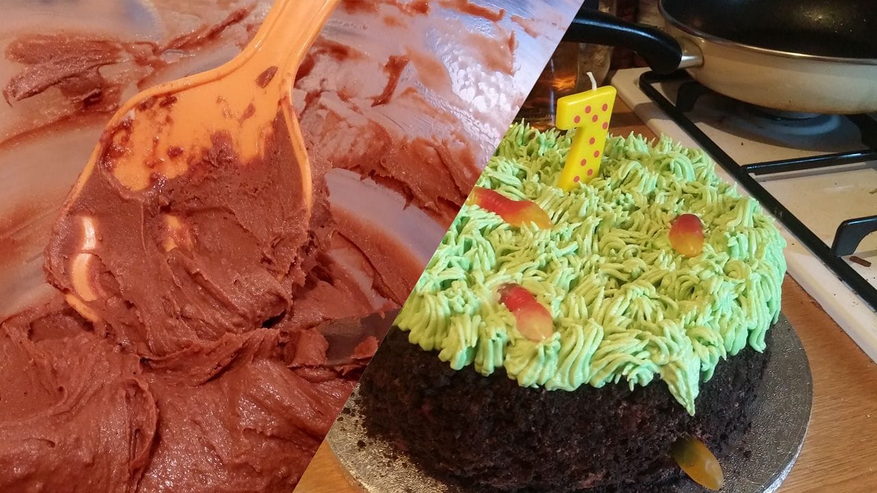 A birthday cake designed to look like a piece of dirt, covered in grass.