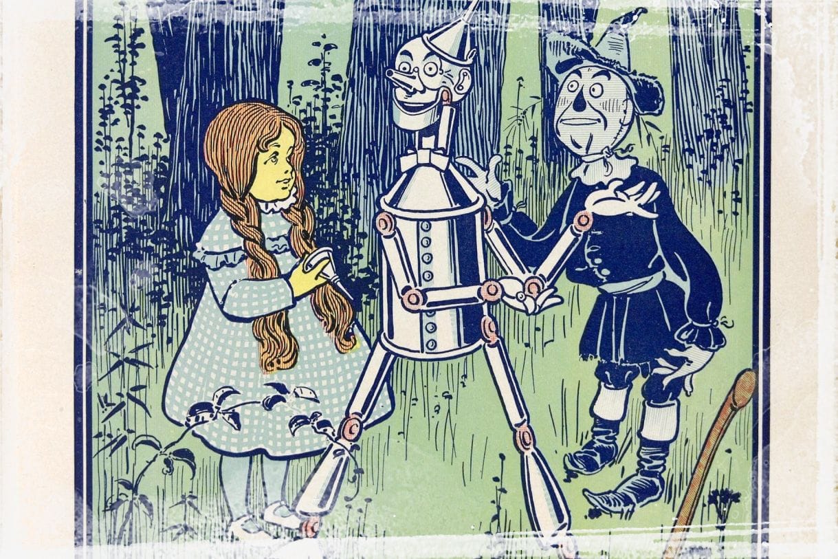 Dorothy reprimanding the cowardly lion as illustrated by W. W. Denslow.