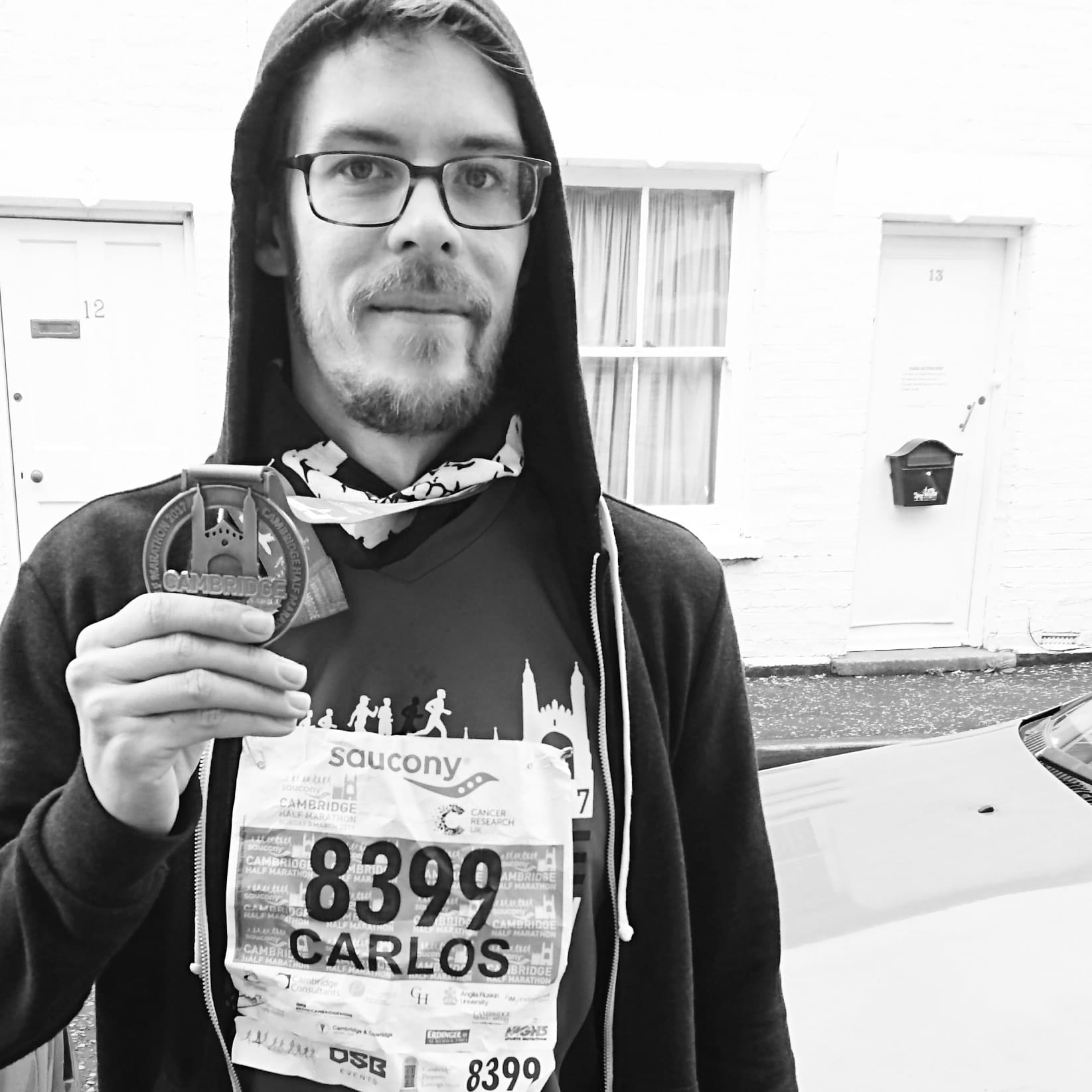 Carlos Eriksson posing with the medal from completing the Cambridge Half 2017.