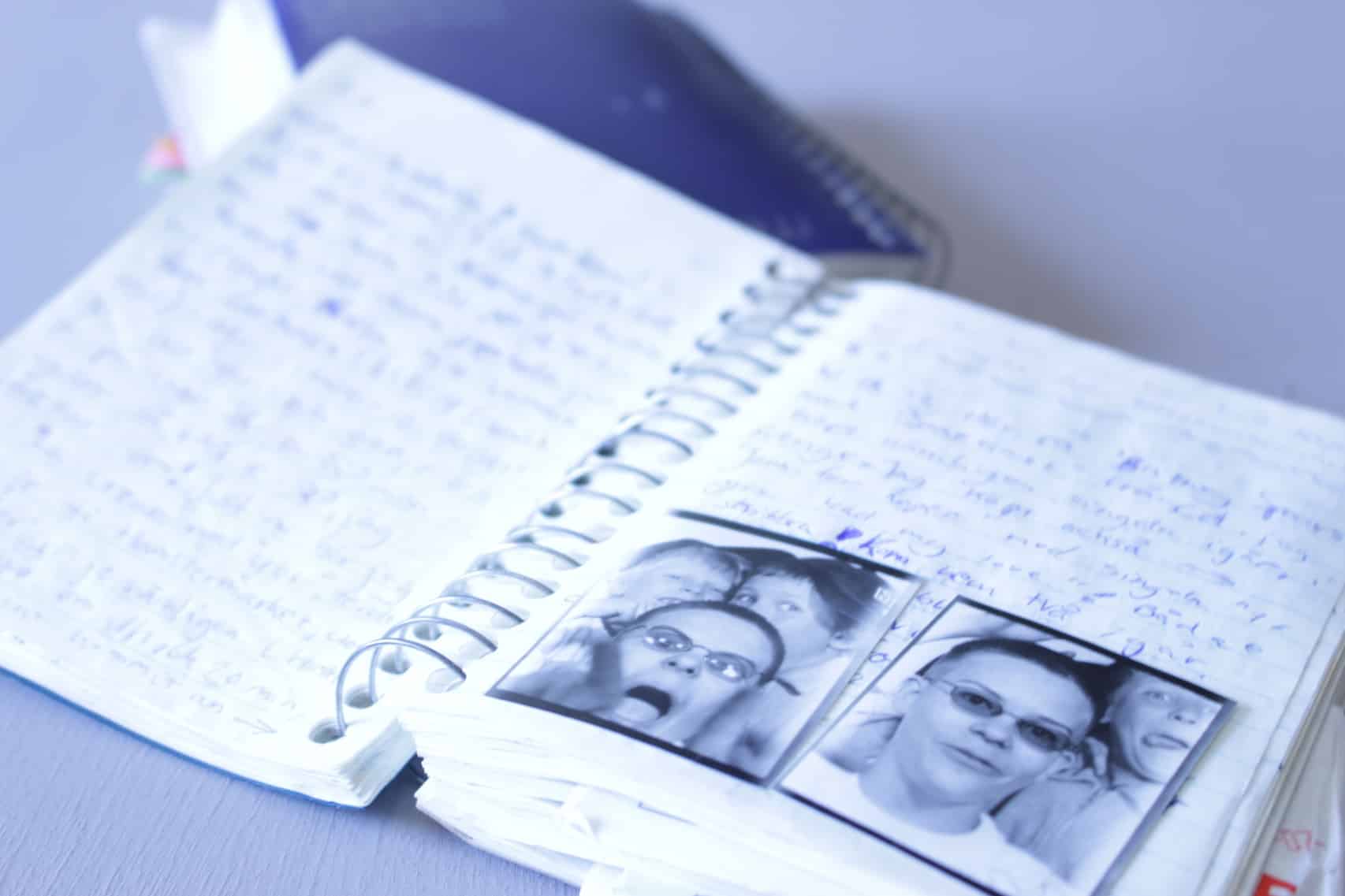 My first diary spread open with photobooth photos of me and my siblings making funny faces.